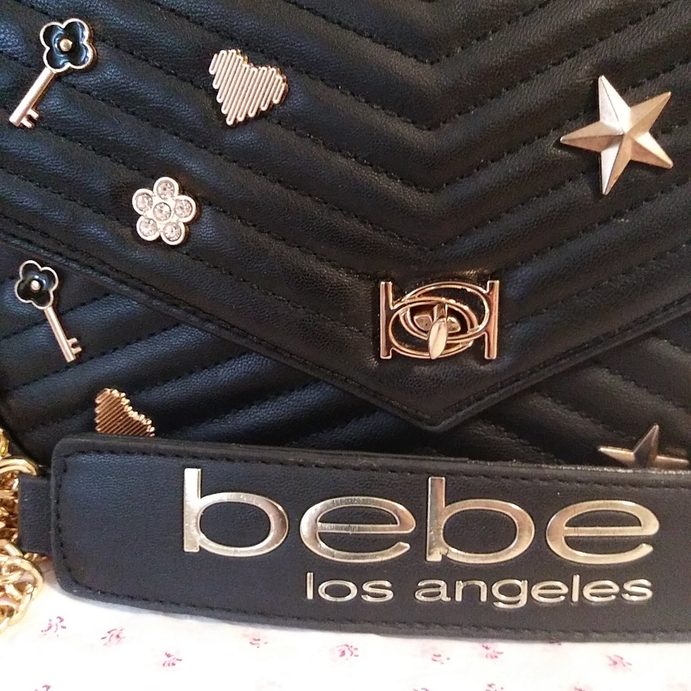 - Brand new never used luxurious Bebe Los Angeles Black Leather and gold s…